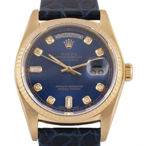 Reloj unisex rolex day date oro y piel y esfera azul, una pieza clásica de lujo para quienes buscan elegancia y distinción.