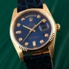 Reloj unisex rolex day date oro y piel y esfera azul, una pieza clásica de lujo para quienes buscan elegancia y distinción.