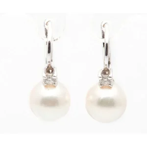 Pendientes oro blanco perlas y detalles de diamantes.