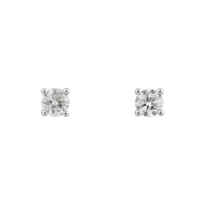 Pendientes dormilonas de oro blanco y diamantes brillantes.