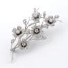 BROCHE FLORAL DE ORO BLANCO CON DIAMANTES